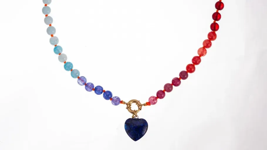 Multicolored bead necklace with heart pendant.