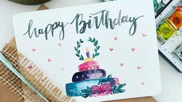 Colorful birthday card with cake illustration.