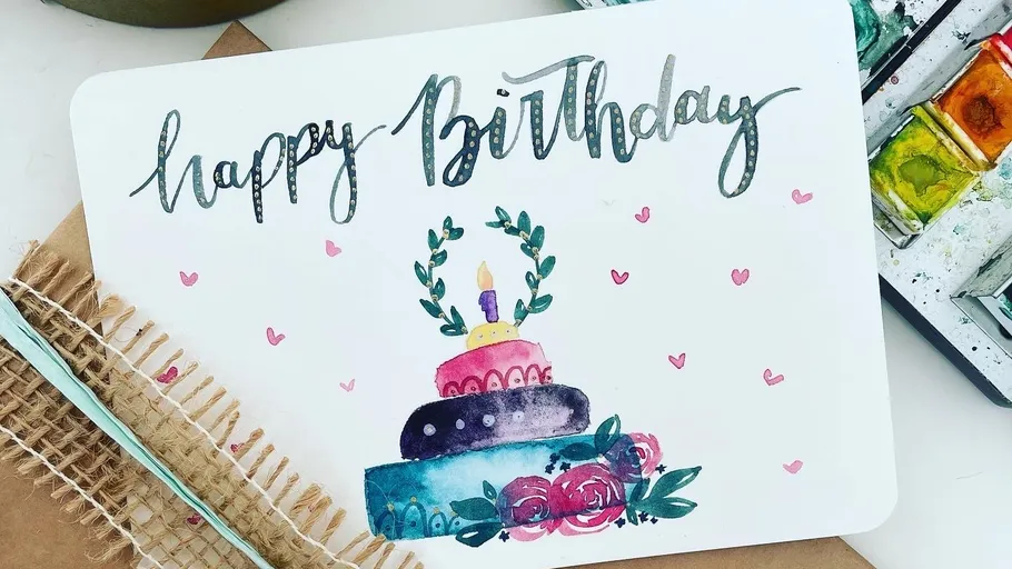 Bunte Geburtstagskarte mit Kuchenillustration.