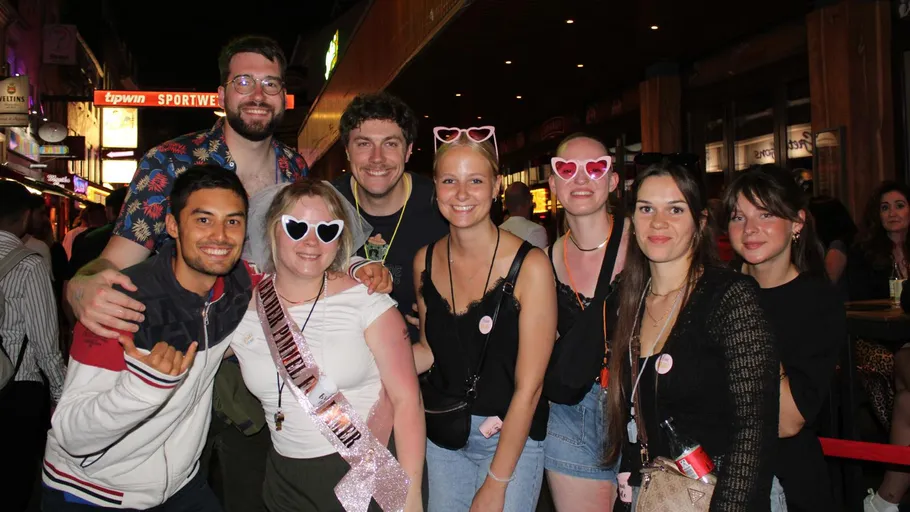 Group of smiling people on a night out.