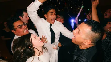 People dancing and celebrating at a party.