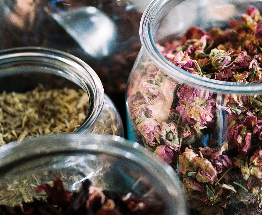 Jars filled with various dried herbs.