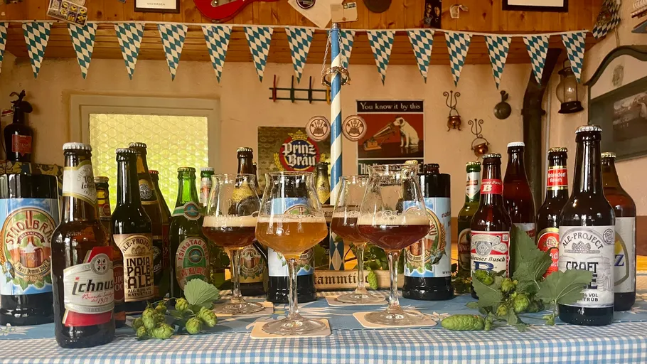 Various beer bottles on a decorated table.