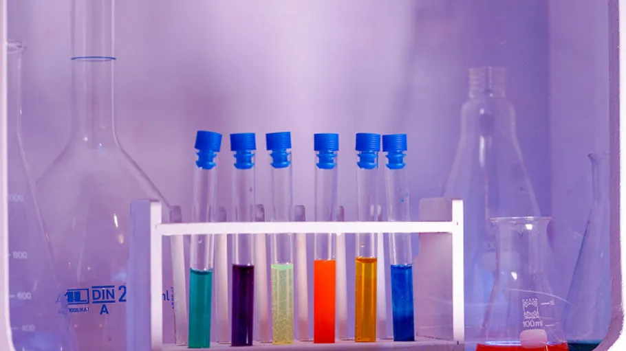 Colorful test tubes in a laboratory setting.