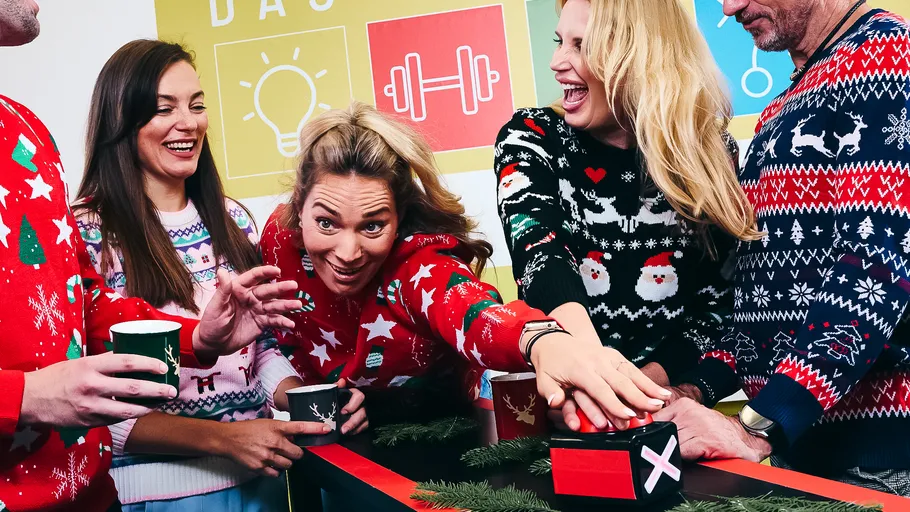 Group of people enjoying a holiday game.