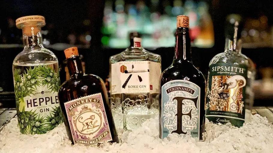 Bottles of gin displayed on ice.