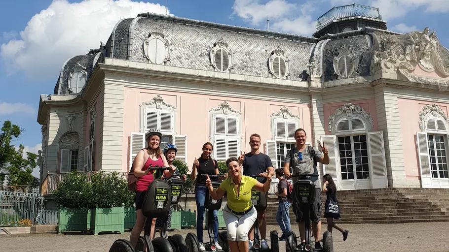 Group on Segways in front of historic building.