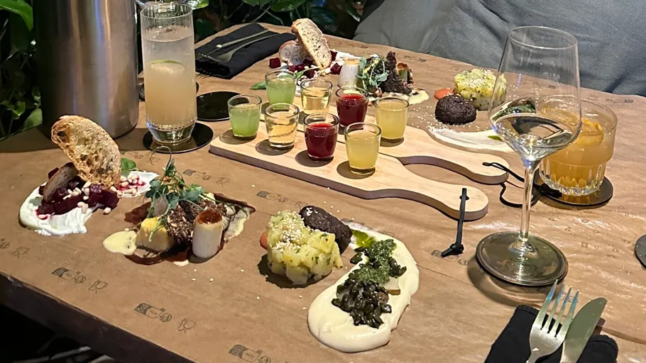 Assorted appetizers and drinks on a table.