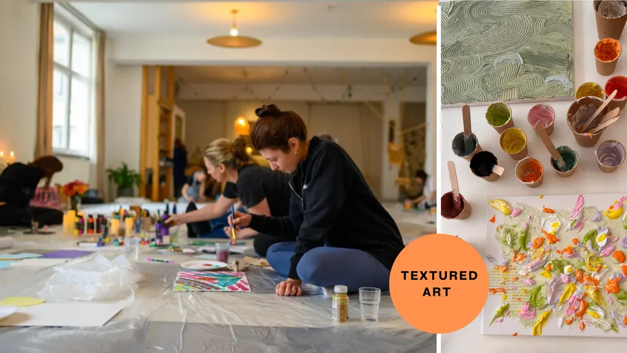 Kunstworkshop mit Menschen, die auf dem Boden malen.