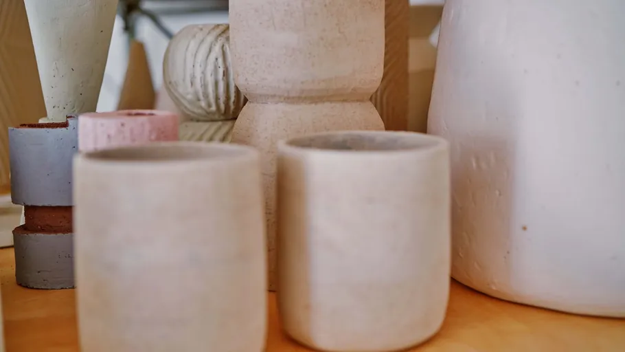 Ceramic pots in various sizes and colors displayed.