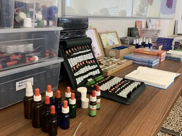 Bottles and cases on a wooden table.