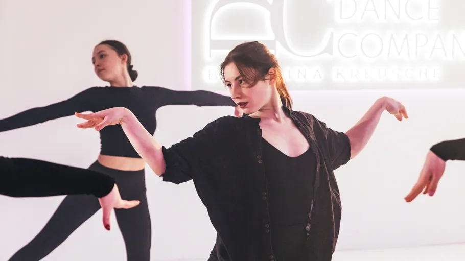 Dancers performing in a studio setting.