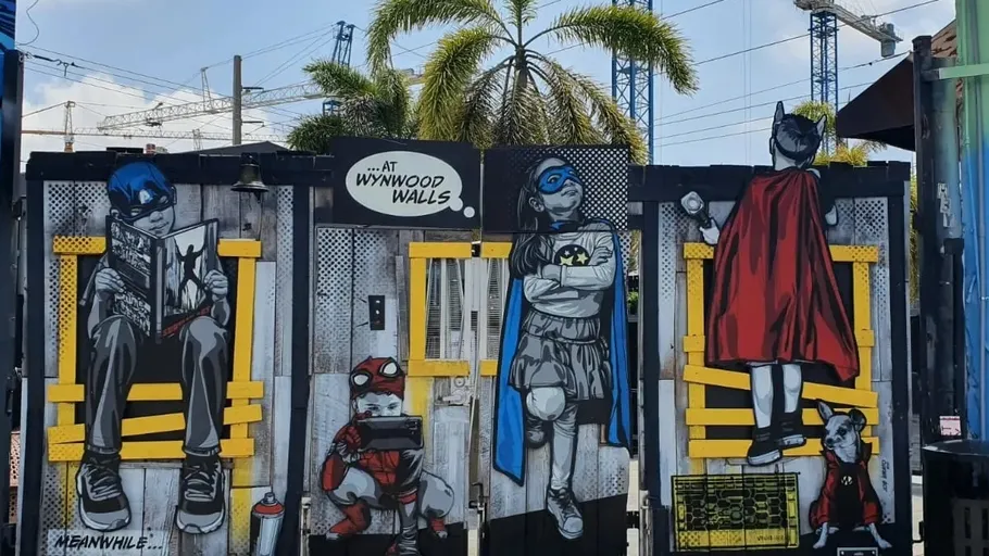 Street art superheroes on urban wall.