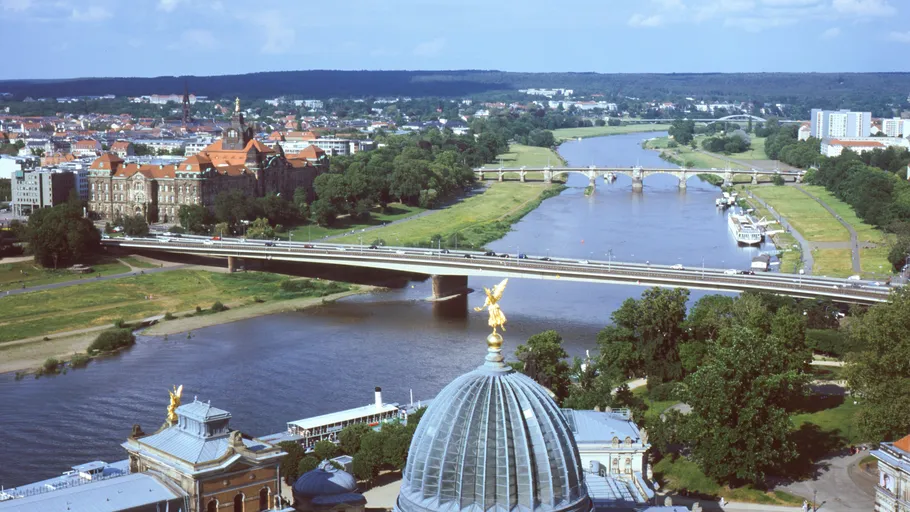 River flows through city with bridges.