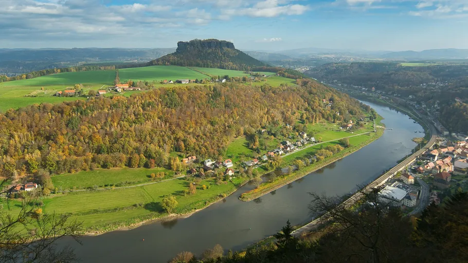 Hill overlooking a river in autumn landscape.