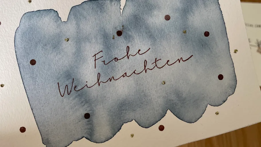 Card with festive greeting, watercolor background.