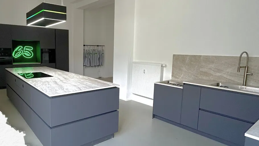 Modern kitchen with gray cabinets and island.