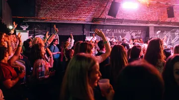 Crowd enjoys music at a lively concert.