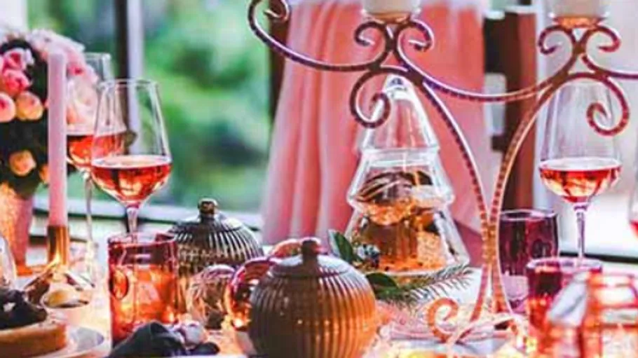 Elegant dining table setup with wine glasses.