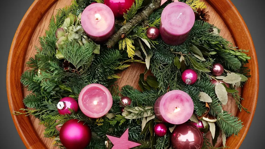 Christmas wreath with candles and ornaments.